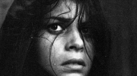 Monochrome close-up of a tense woman